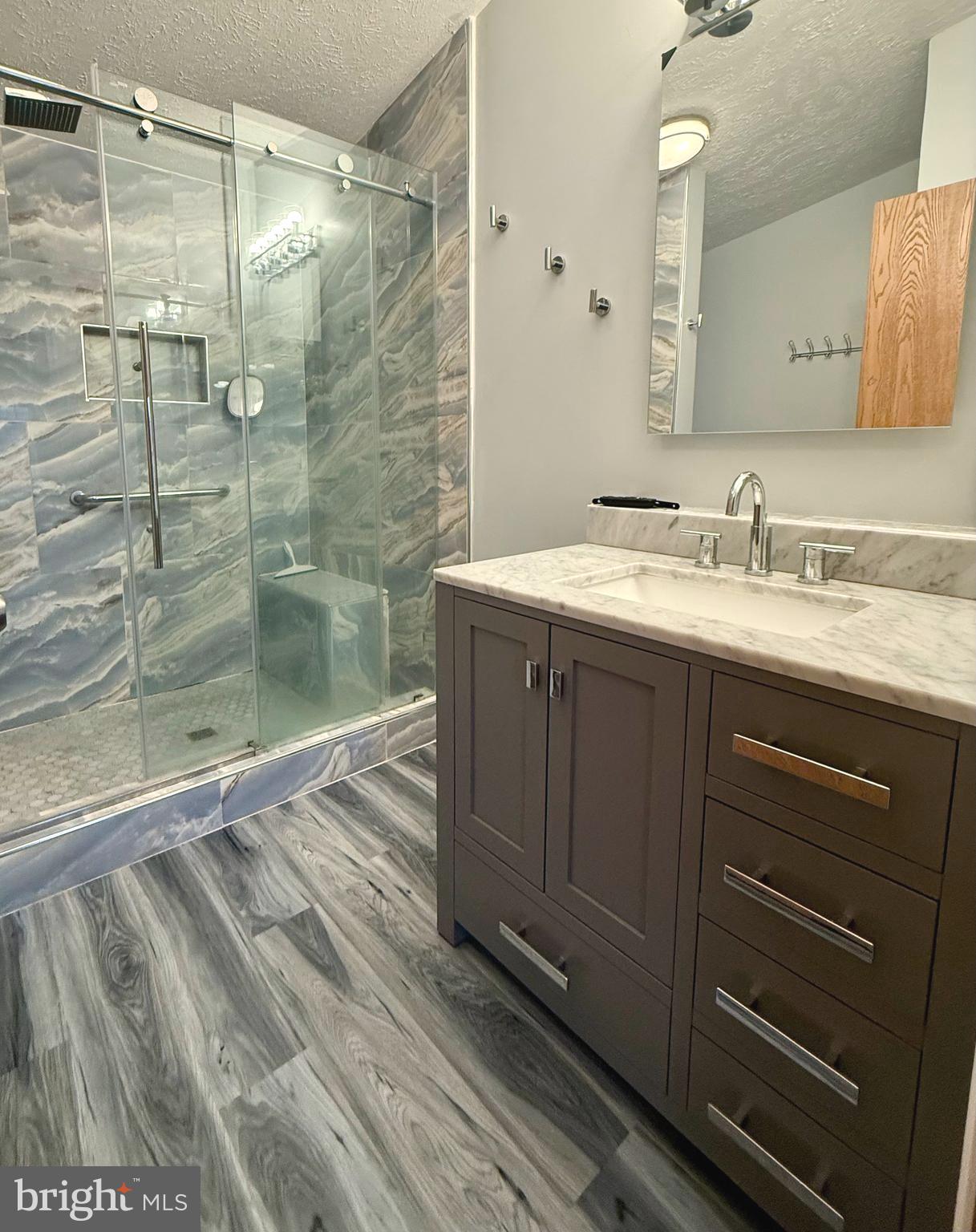 92 Arrowhead Road Shamong, NJ 08088 - Photo 21 of 25 a bathroom with a granite countertop sink mirror and shower