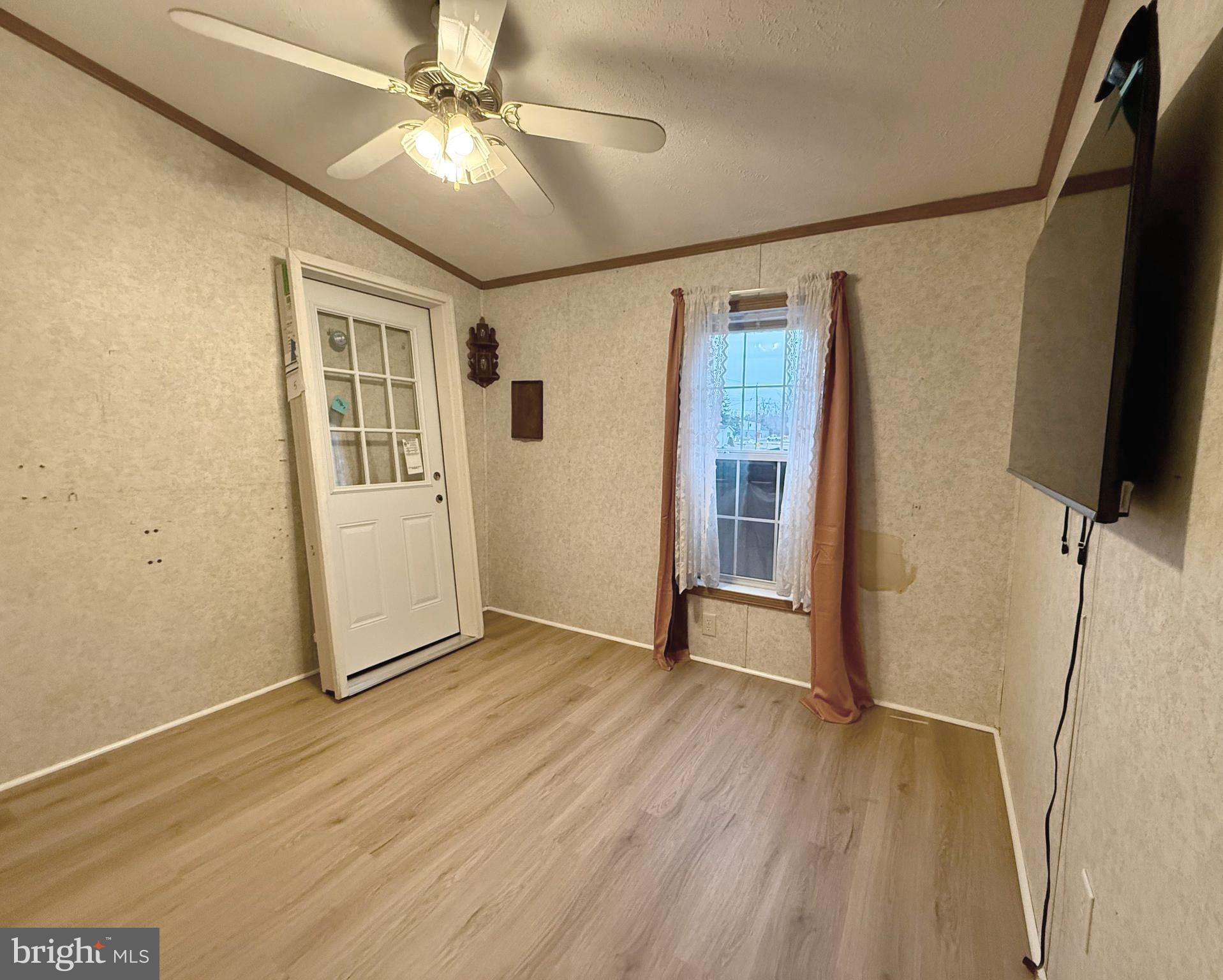 92 Arrowhead Road Shamong, NJ 08088 - Photo 24 of 25 a view of an empty room with wooden floor and a ceiling fan