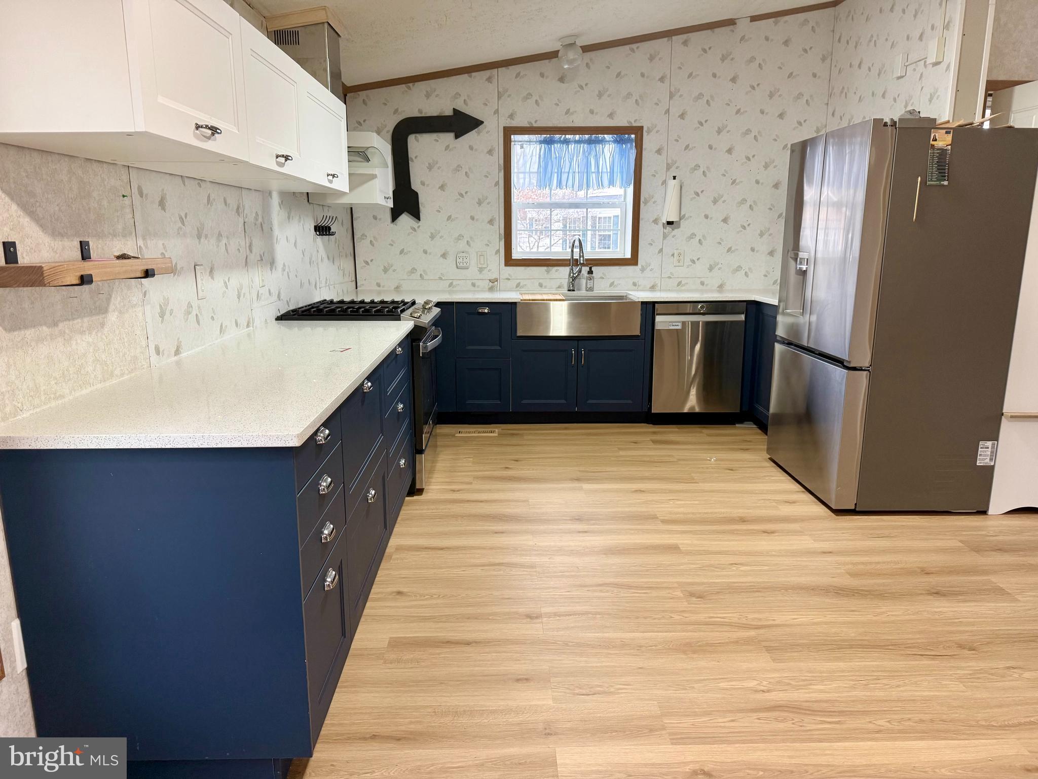 92 Arrowhead Road Shamong, NJ 08088 - Photo 9 of 25 a kitchen with stainless steel appliances a sink and a refrigerator