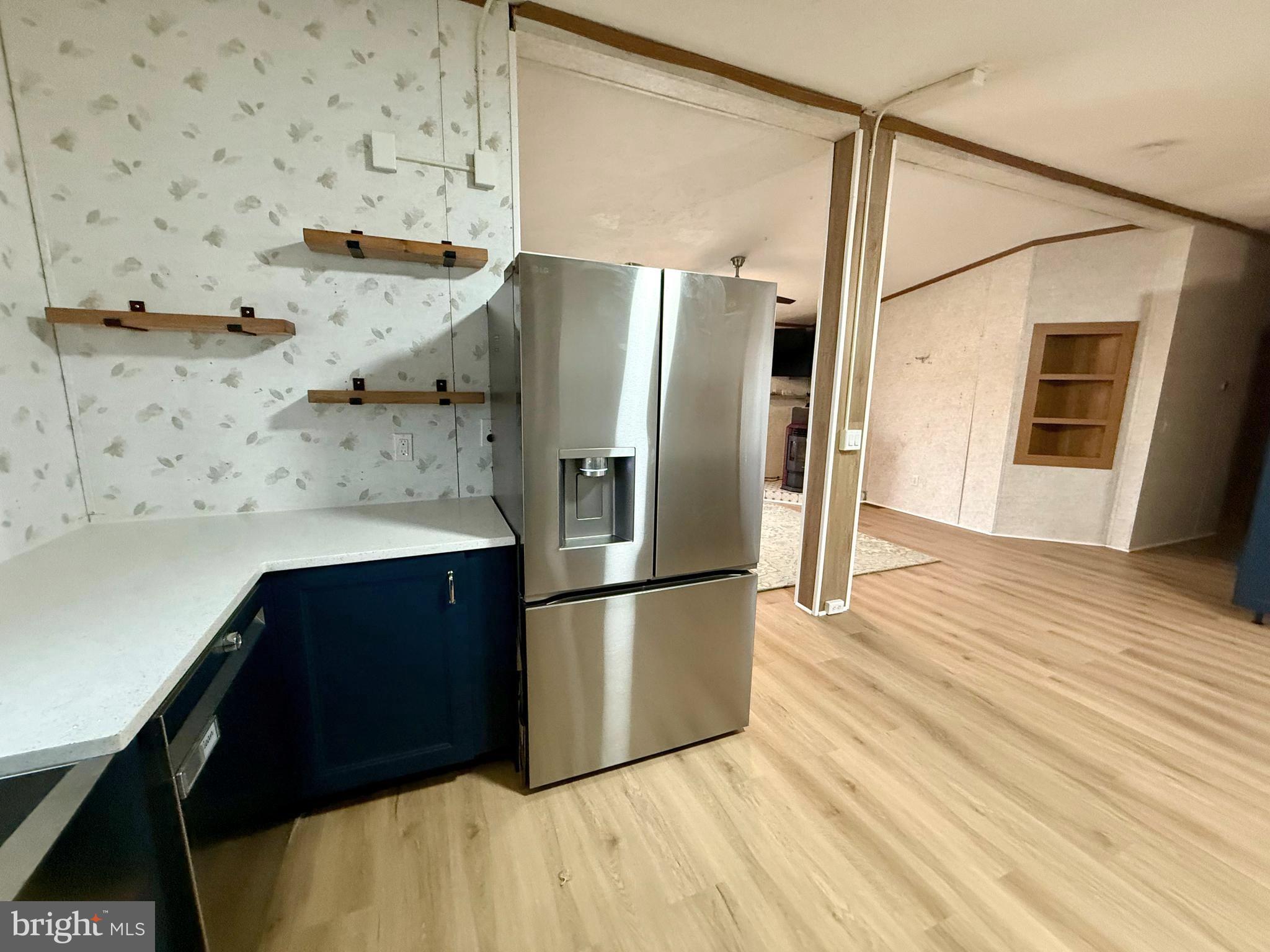 92 Arrowhead Road Shamong, NJ 08088 - Photo 10 of 25 a kitchen with stainless steel appliances a refrigerator and a wooden floor
