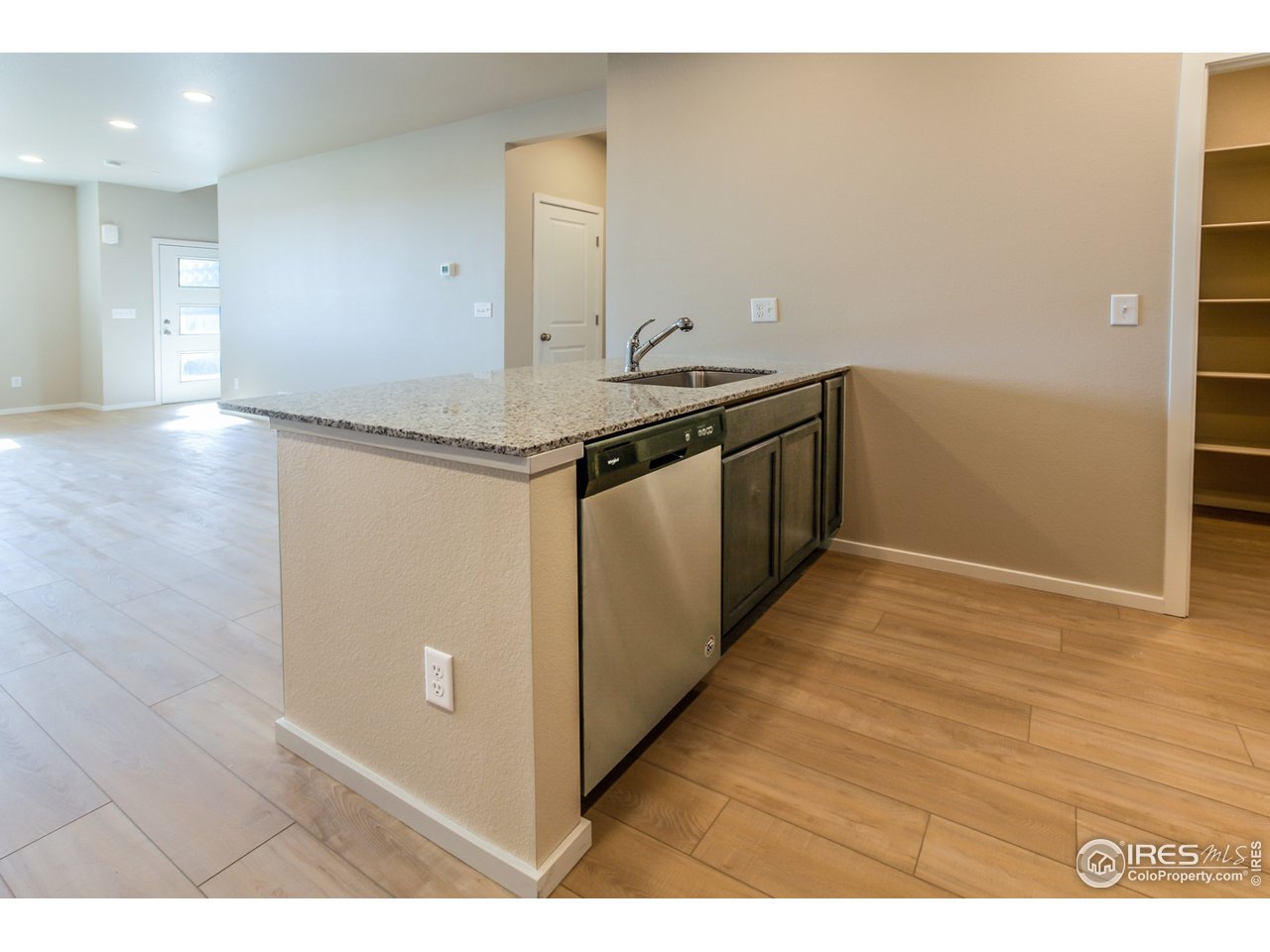 6613 4th St Road, Unit 4 Greeley, CO 80634 - Photo 11 of 34 EXAMPLE PHOTO: KITCHEN OVERLOOKING DINING & LIVING ROOM