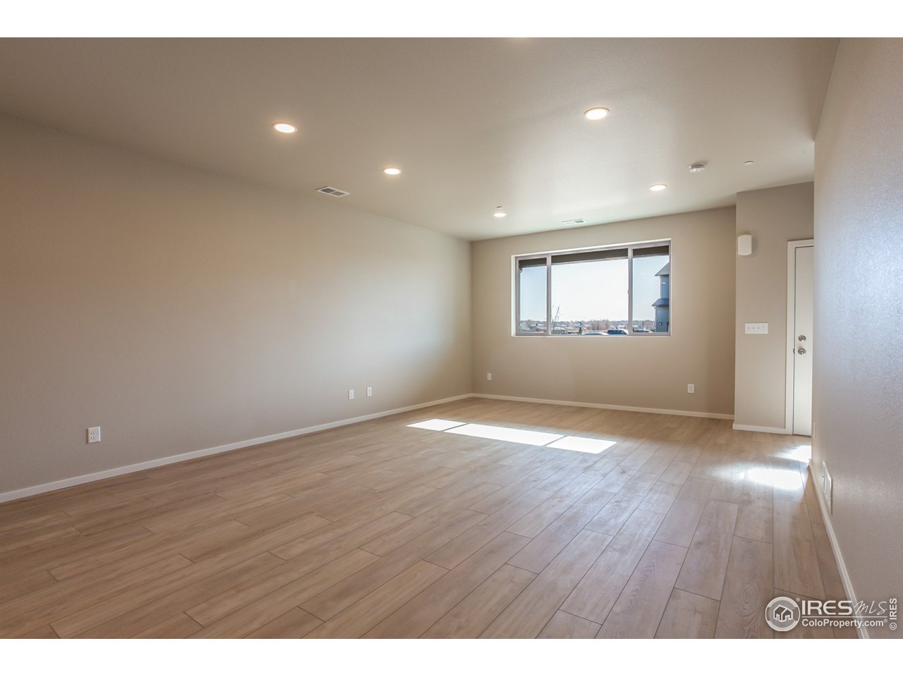 6613 4th St Road, Unit 4 Greeley, CO 80634 - Photo 5 of 34 EXAMPLE PHOTO: LIVING ROOM & DINING ROOM