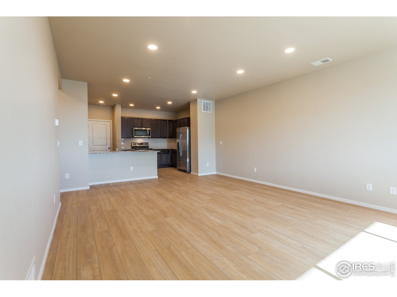 6613 4th St Road, Unit 4 Greeley, CO 80634 - Photo 6 of 34 EXAMPLE PHOTO: LIVING ROOM, DINING ROOM, KITCHEN
