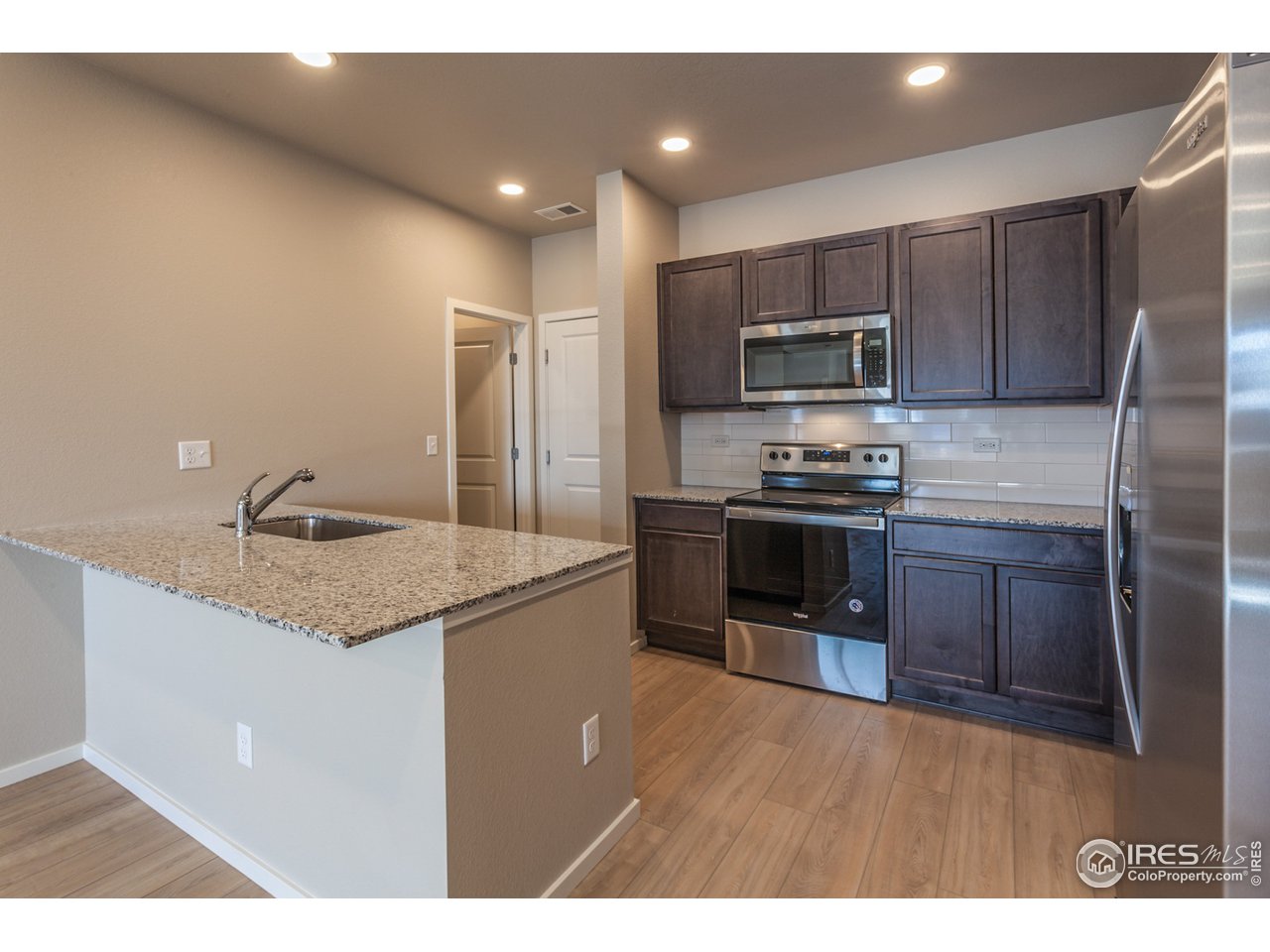 6613 4th St Road, Unit 4 Greeley, CO 80634 - Photo 9 of 34 EXAMPLE PHOTO: KITCHEN W/ ISLAND