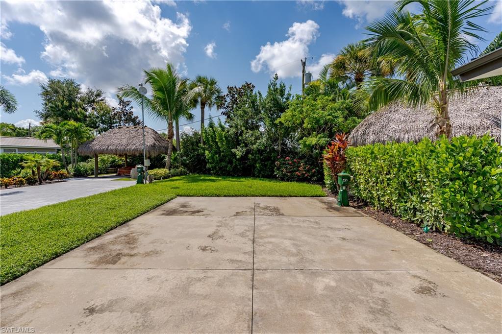 13499 Snook Circle Naples, FL 34114 - Photo 14 of 39 a view of a garden with a building