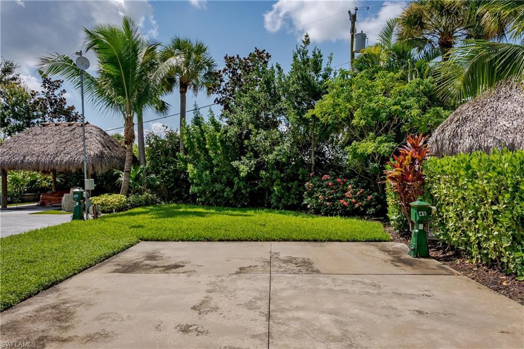 13499 Snook Circle Naples, FL 34114 - Photo 15 of 39 a view of a garden