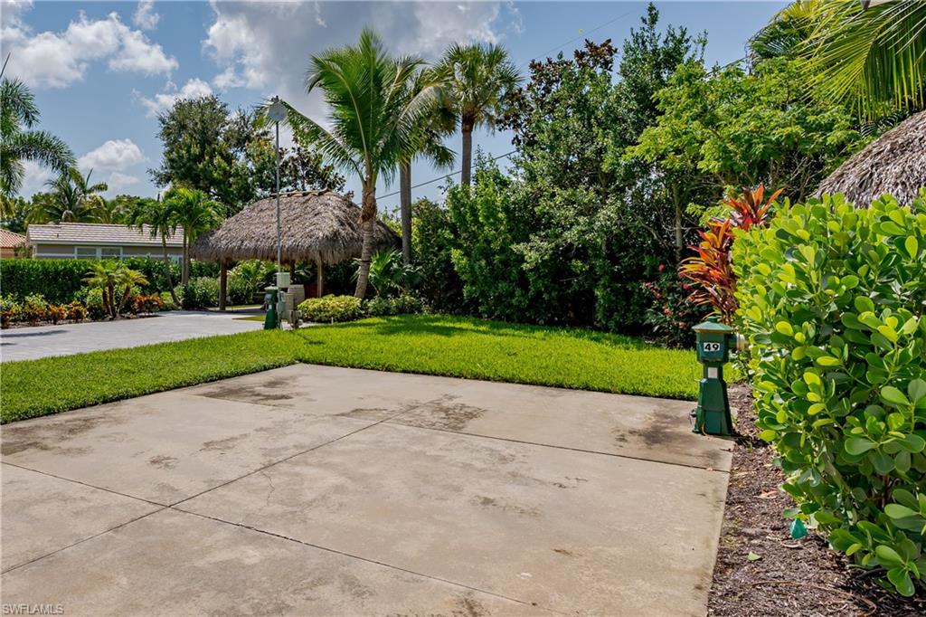 13499 Snook Circle Naples, FL 34114 - Photo 17 of 39 a view of a park with plants and palm trees