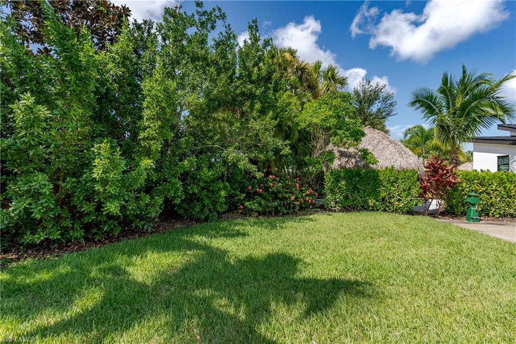 13499 Snook Circle Naples, FL 34114 - Photo 21 of 39 a view of an outdoor space and a yard