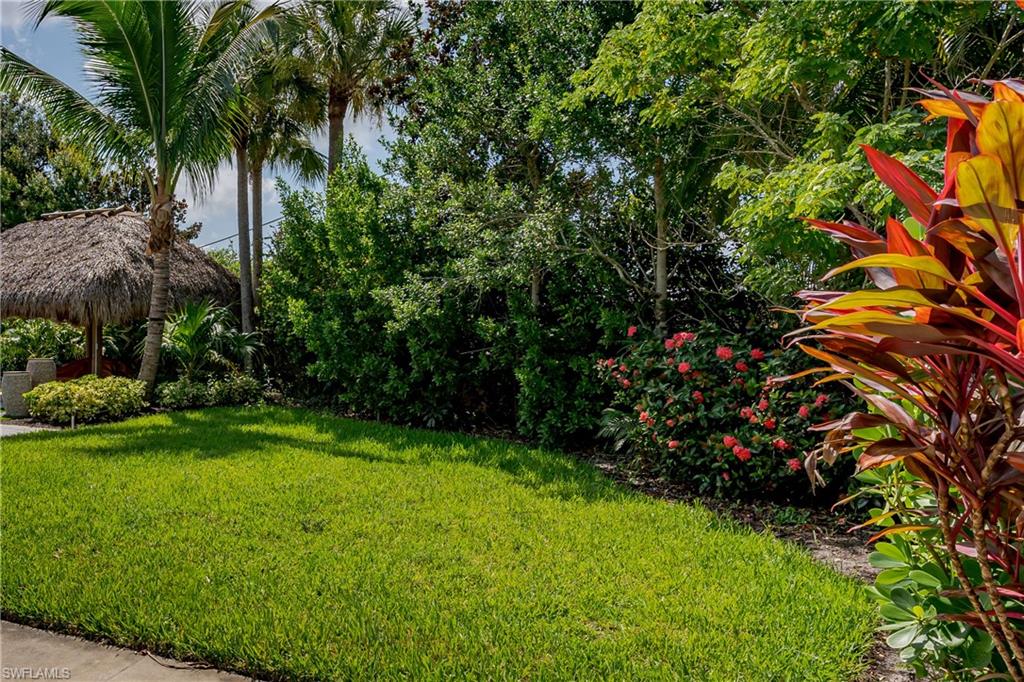 13499 Snook Circle Naples, FL 34114 - Photo 4 of 39 a view of a garden