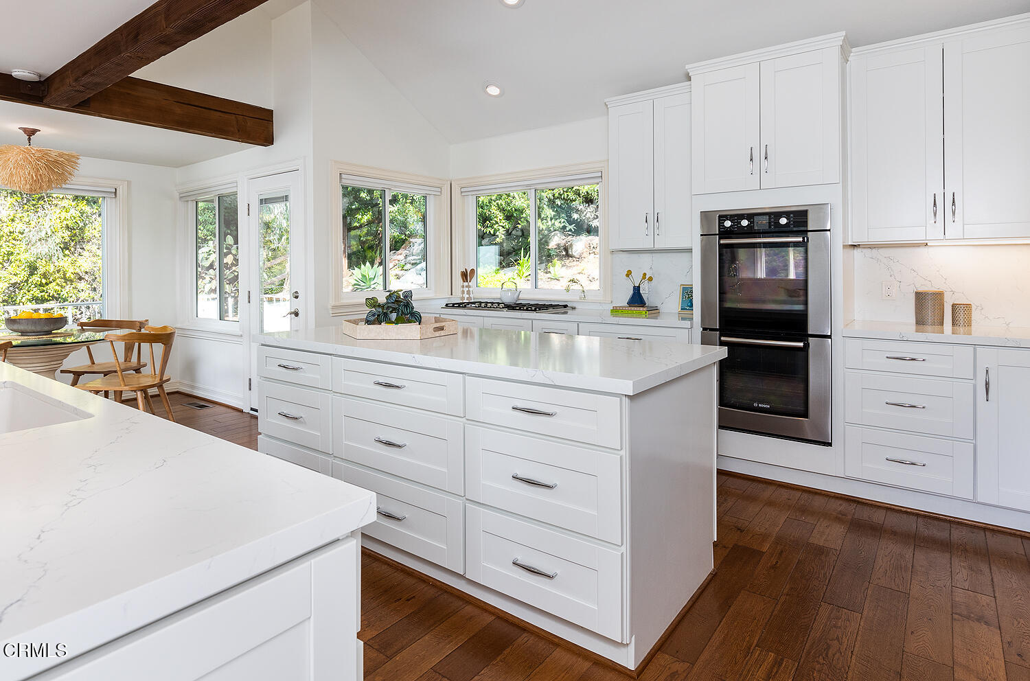 1386 Glen Oaks Boulevard Pasadena, CA 91105 - Photo 17 of 47 a kitchen with granite countertop white cabinets and stainless steel appliances