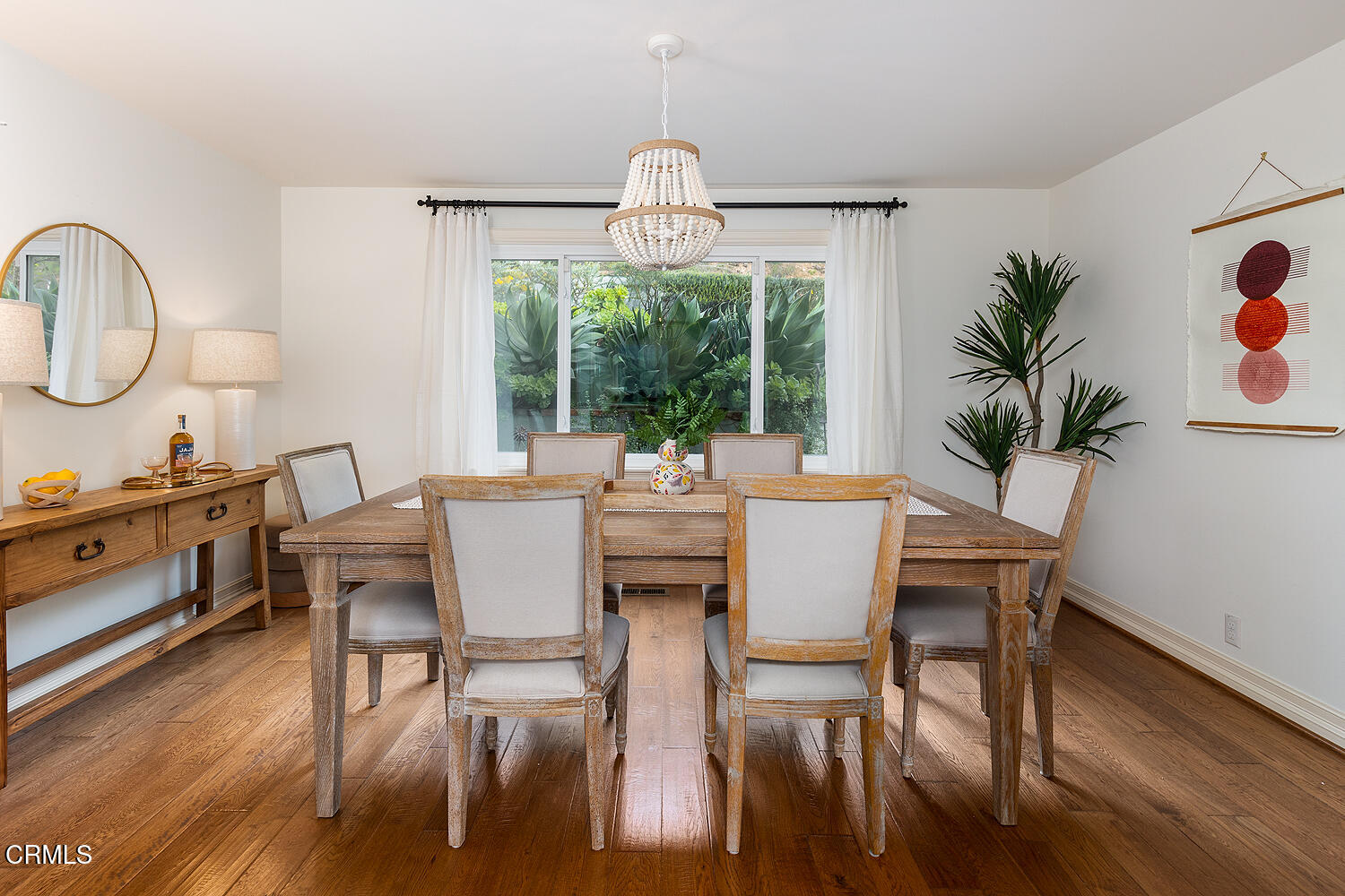 1386 Glen Oaks Boulevard Pasadena, CA 91105 - Photo 22 of 47 a dining room with furniture a chandelier and wooden floor