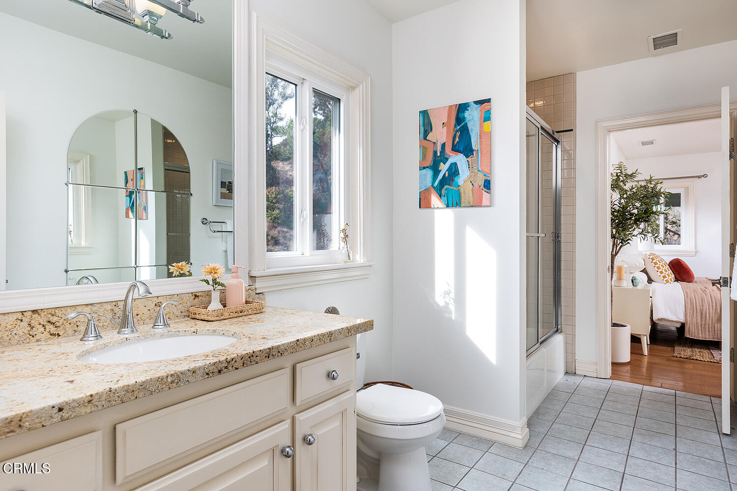 1386 Glen Oaks Boulevard Pasadena, CA 91105 - Photo 39 of 47 a spacious bathroom with a granite countertop sink a toilet and a mirror