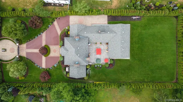 an aerial view of a house with a garden
