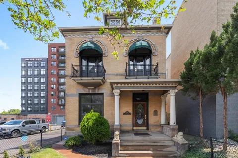 a view of a building with potted plants