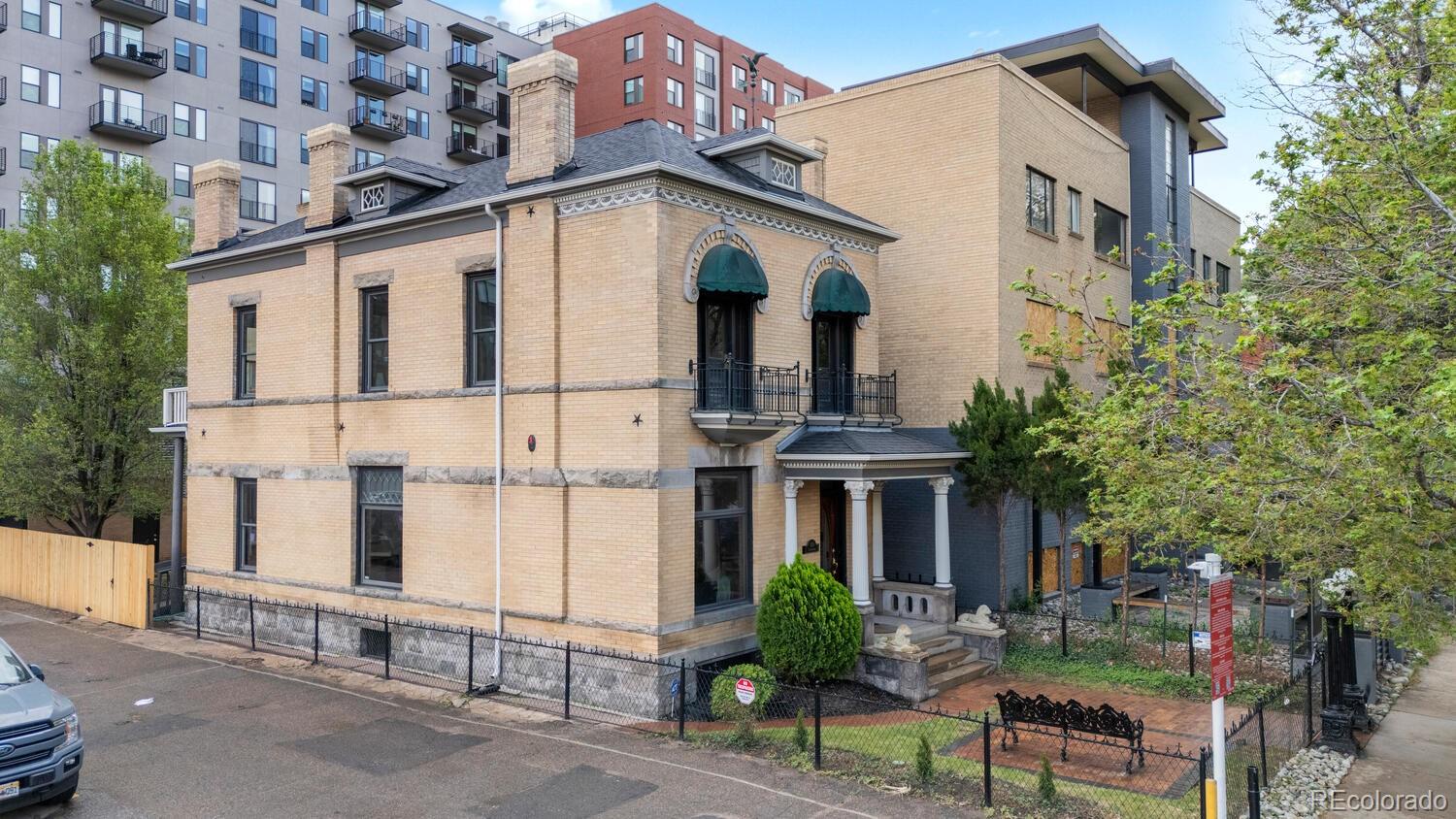 a view of a white building with large windows