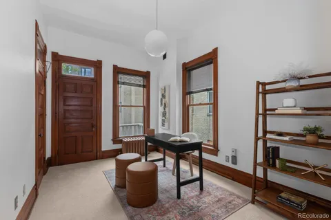 a livingroom with furniture and window