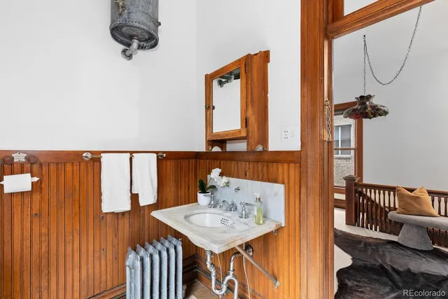 a view of a room with a table and chairs