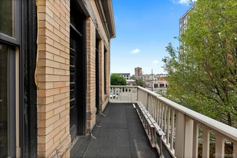 a view of a balcony with city view