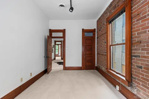 a view of a room with large windows