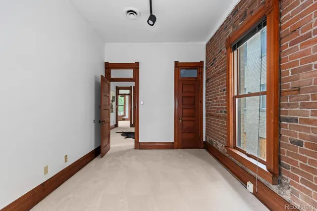 a view of a room with large windows