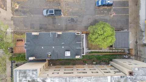 an aerial view of a house with a yard and a garden