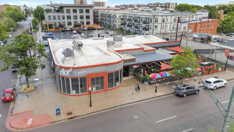 an outdoor space with patio furniture and potted plants