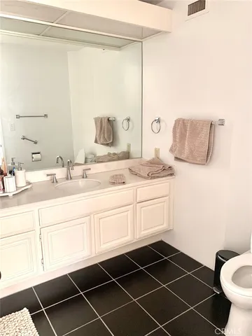 a bathroom with a sink and a window