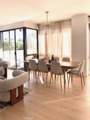 a bedroom with a bed and a potted plant