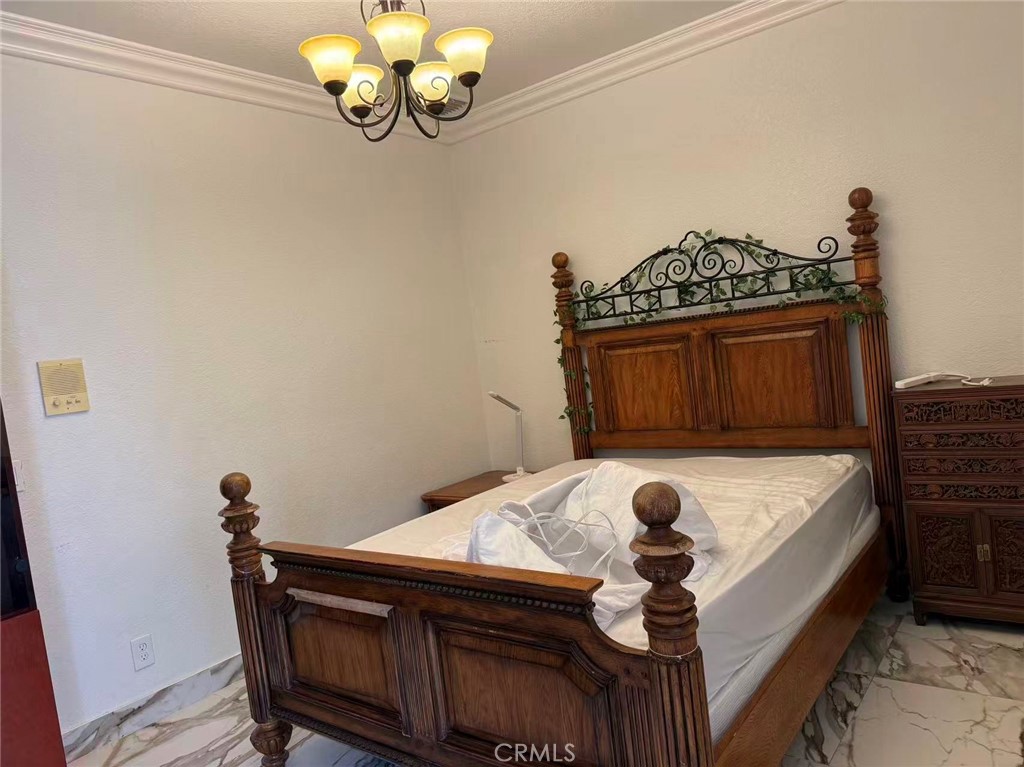 18421 Rocky Court Rowland Heights, CA 91748 - Photo 1 of 9 a bedroom with a bed and a table in it