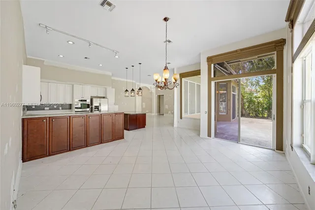 a view of a kitchen with a sink and a window