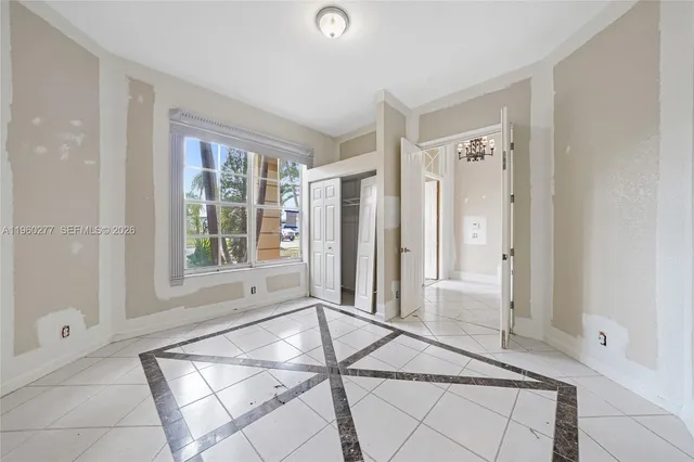 a room with a bed and a window