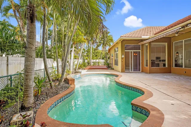 a view of a house with a swimming pool