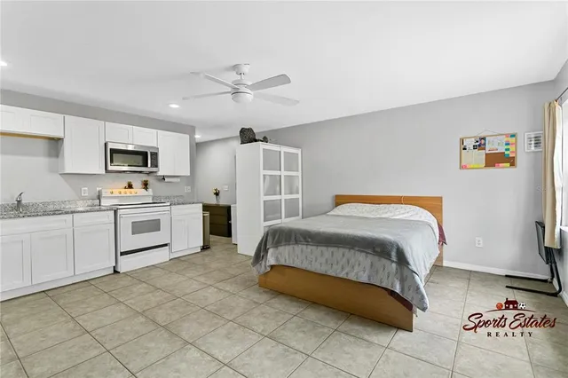 a bedroom with a bed and a walk in closet