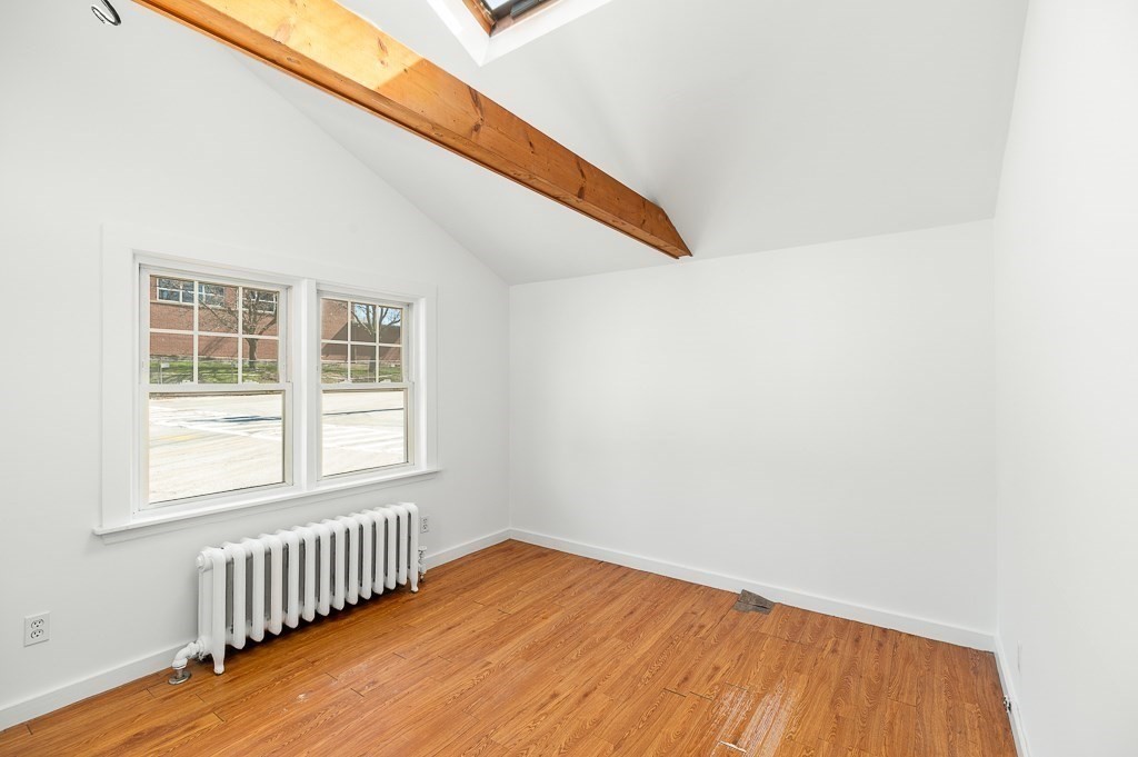 3 Davis St Extension Gloucester, MA 01930 - Photo 14 of 29 an empty room with wooden floor and windows