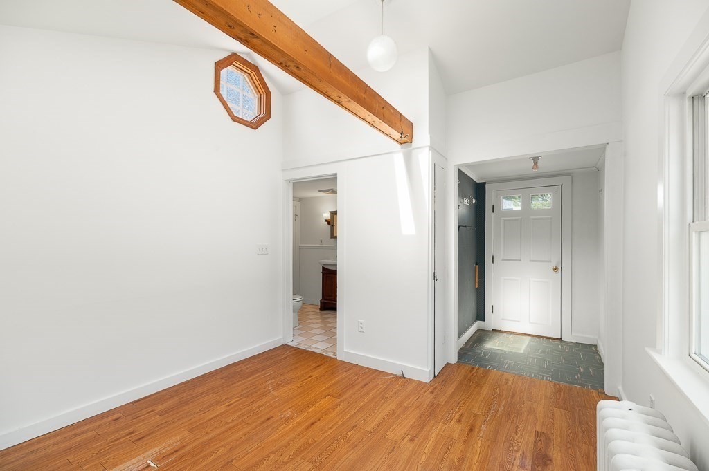 3 Davis St Extension Gloucester, MA 01930 - Photo 15 of 29 a view of a room with wooden floor and a ceiling fan
