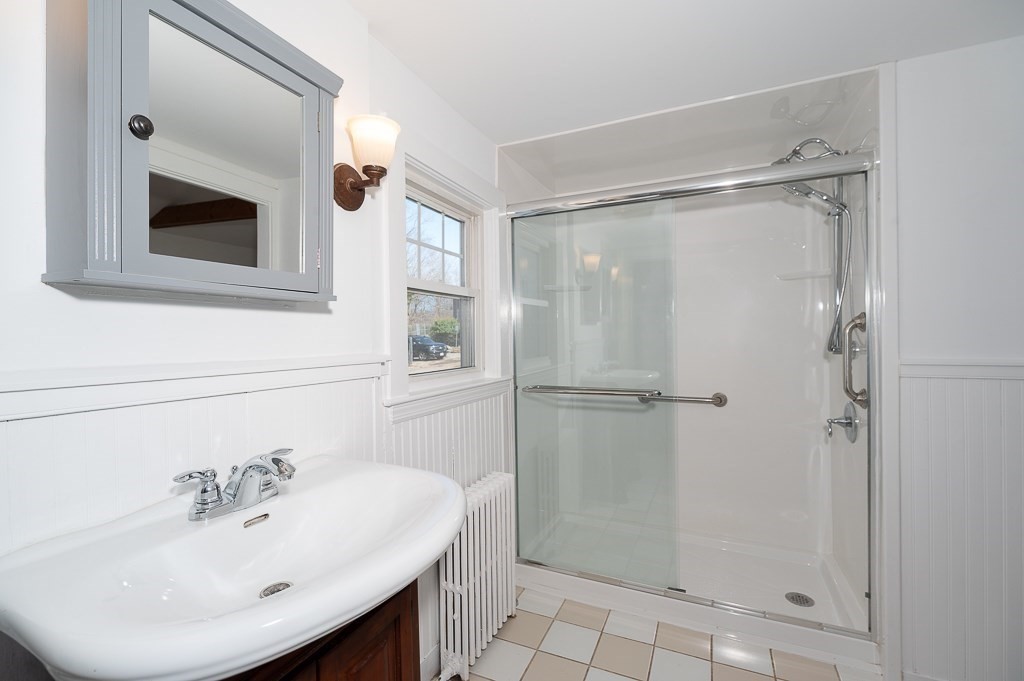 3 Davis St Extension Gloucester, MA 01930 - Photo 16 of 29 a bathroom with a sink mirror and shower