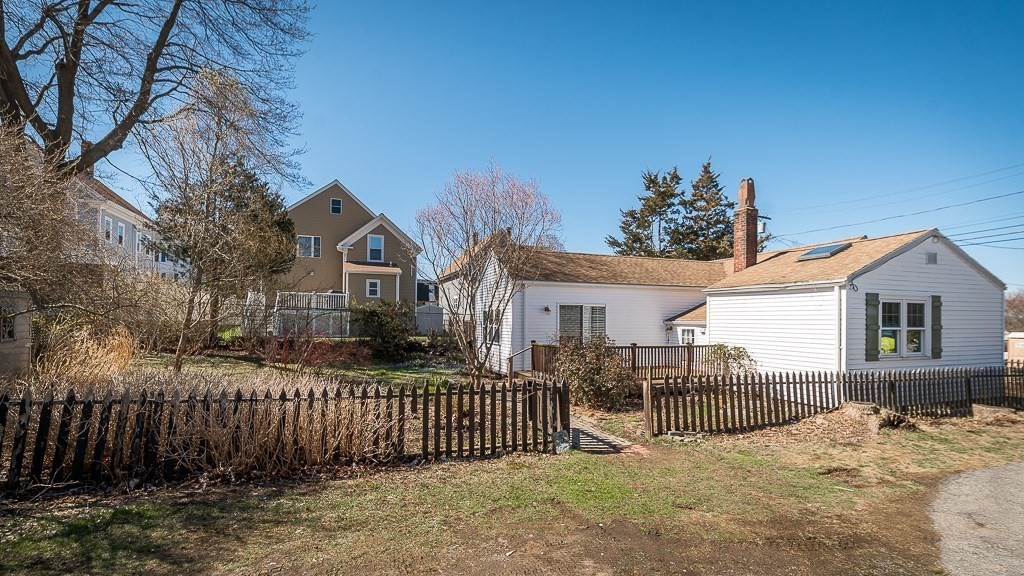 3 Davis St Extension Gloucester, MA 01930 - Photo 18 of 29 a view of a house with a wooden fence