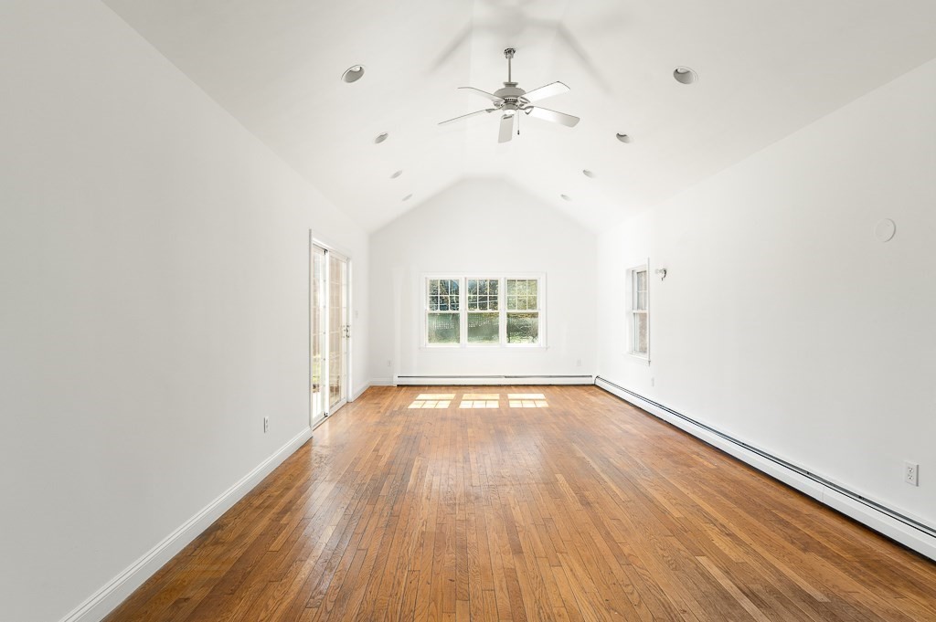 3 Davis St Extension Gloucester, MA 01930 - Photo 23 of 29 wooden floor in an empty room with a window