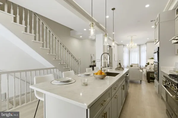 a kitchen that has a lot of cabinets in it