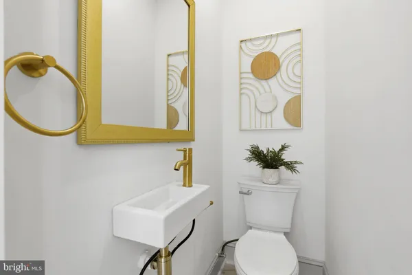 a bathroom with a toilet and sink