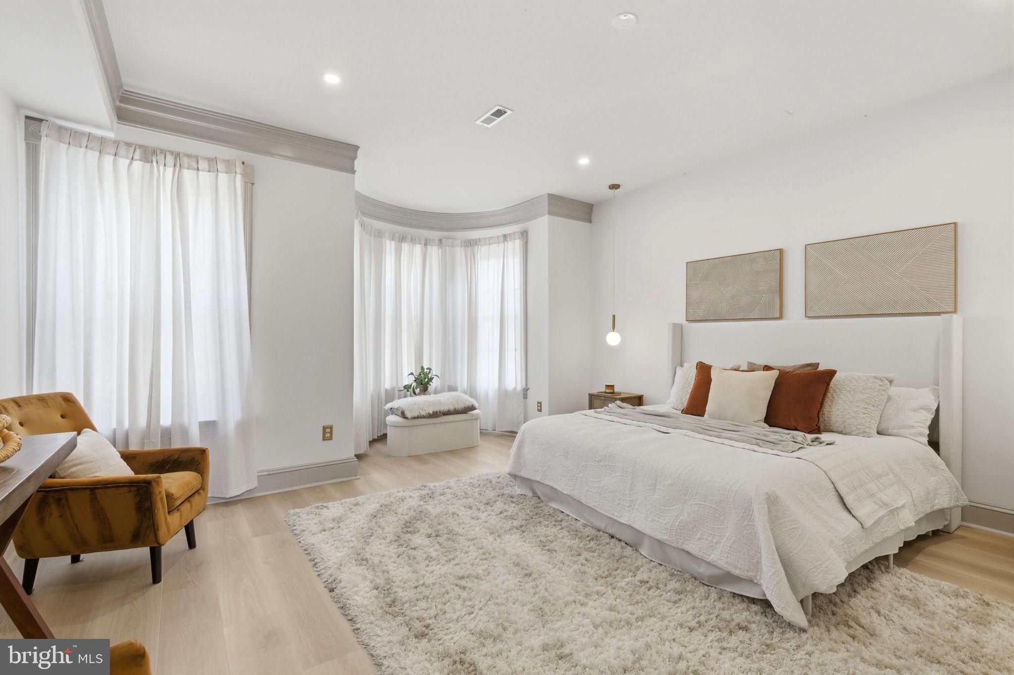 1210 T Street Northwest Washington, DC 20009 - Photo 19 of 41 a bedroom with a bed and a couch