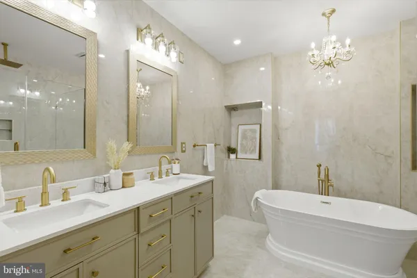 a bathroom with a double vanity sink mirror double and bathtub