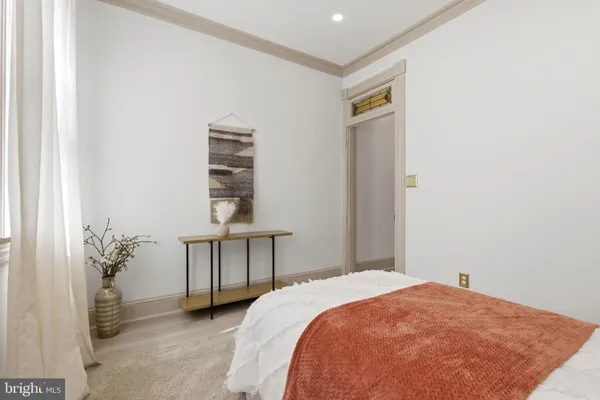 a bedroom with a bed and a table in it