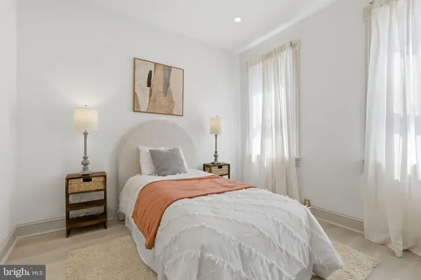 a bed room with a bed and a window