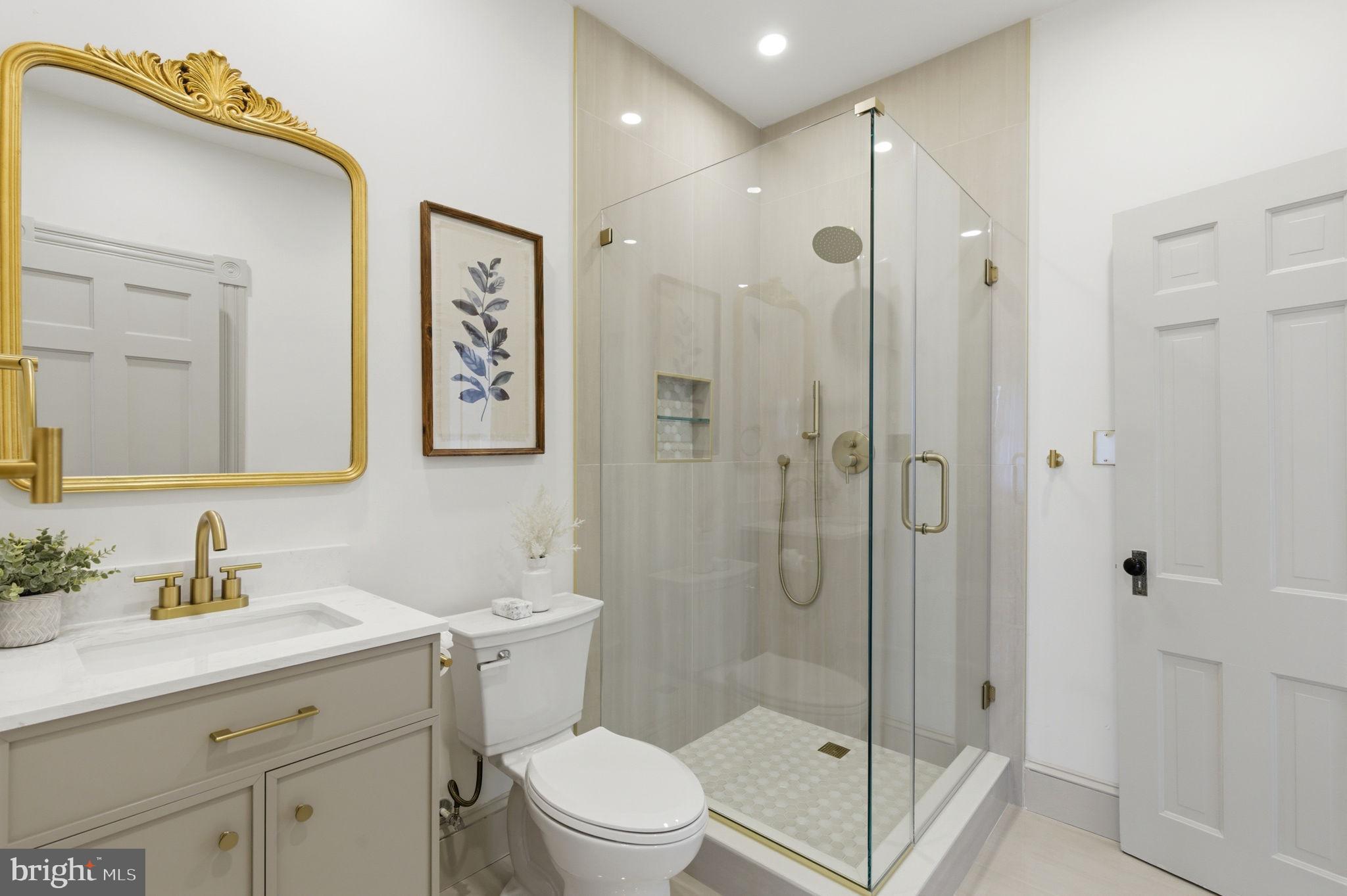 1210 T Street Northwest Washington, DC 20009 - Photo 34 of 41 a bathroom with a shower sink vanity mirror and toilet