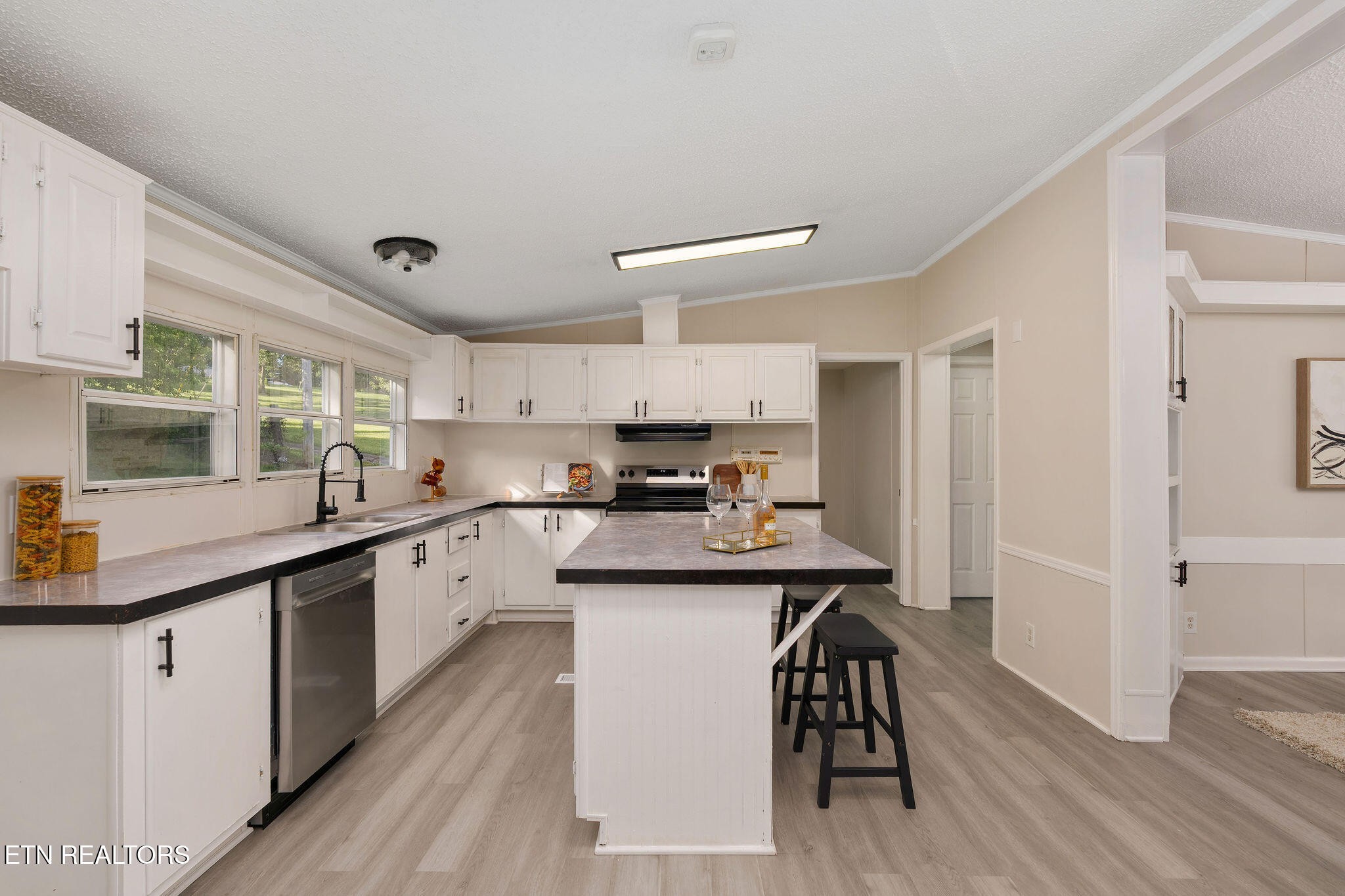 3315 Chuckey Highway Limestone, TN 37681 - Photo 13 of 40 a kitchen with a sink cabinets and wooden floor