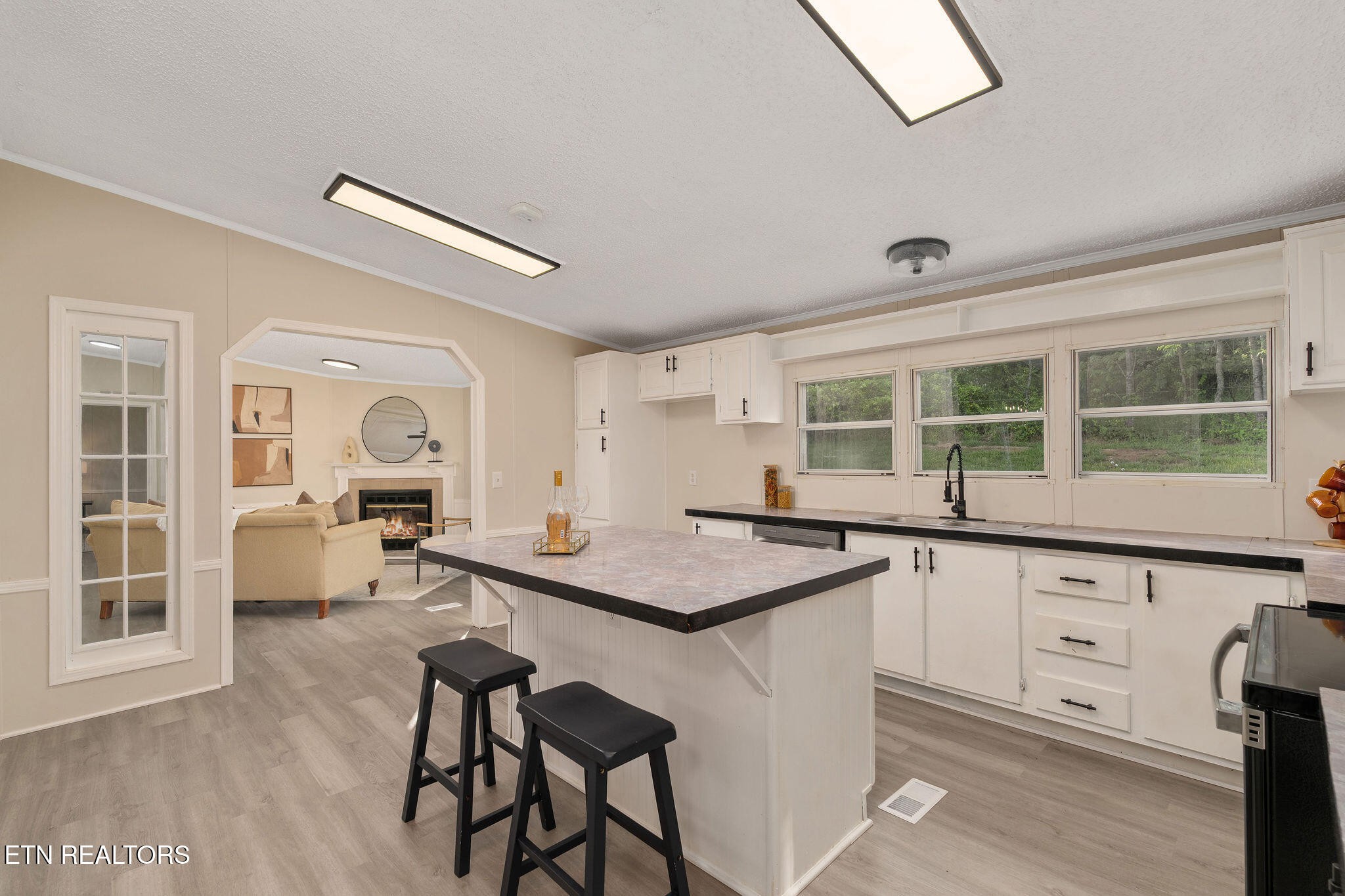 3315 Chuckey Highway Limestone, TN 37681 - Photo 16 of 40 a kitchen with a sink chairs and wooden floor