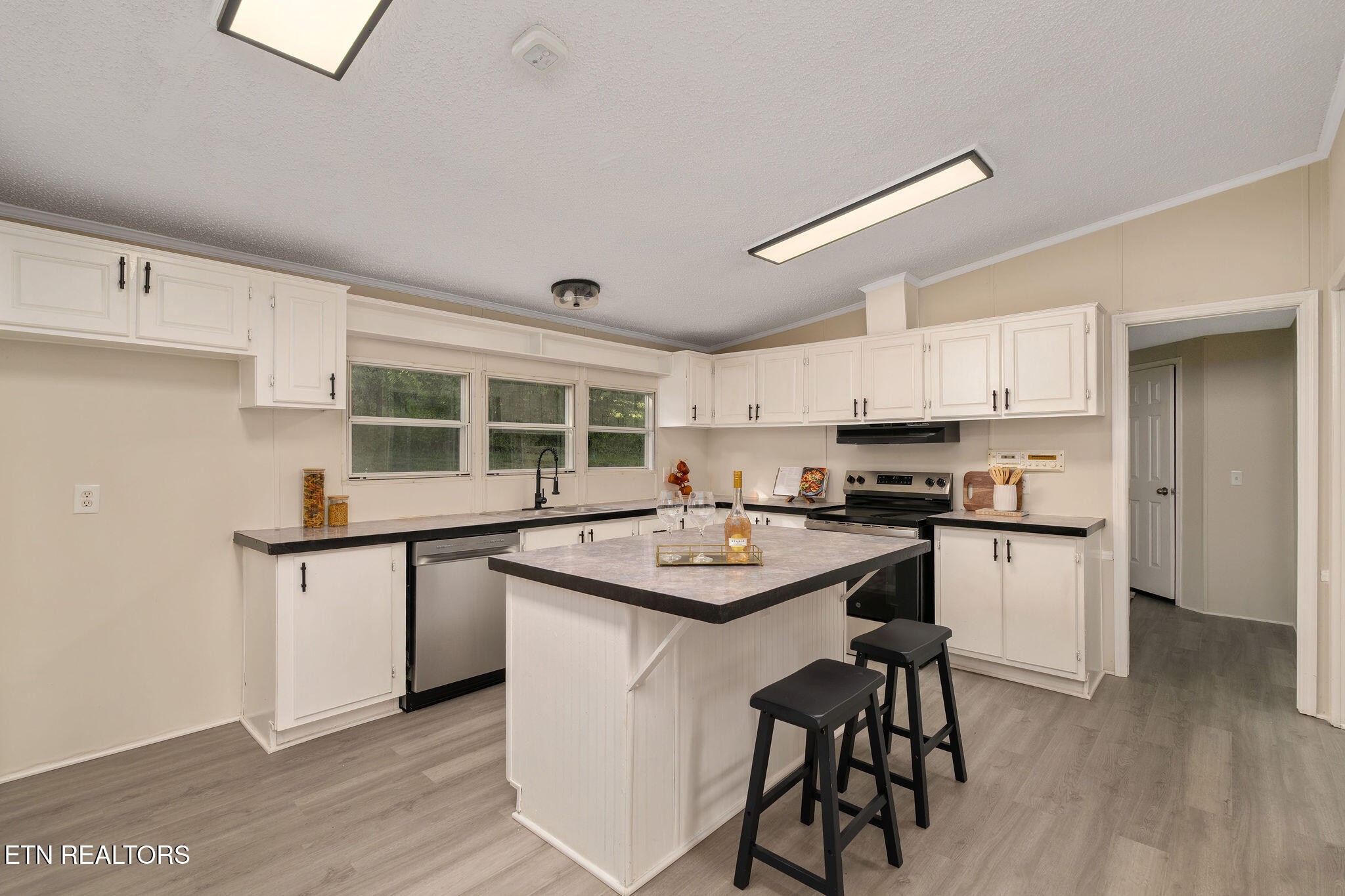 3315 Chuckey Highway Limestone, TN 37681 - Photo 24 of 40 a kitchen with stainless steel appliances granite countertop wooden cabinets and sink