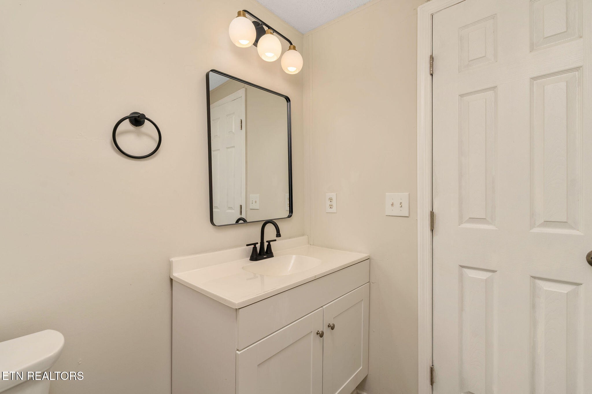 3315 Chuckey Highway Limestone, TN 37681 - Photo 32 of 40 a bathroom with a toilet sink vanity and mirror