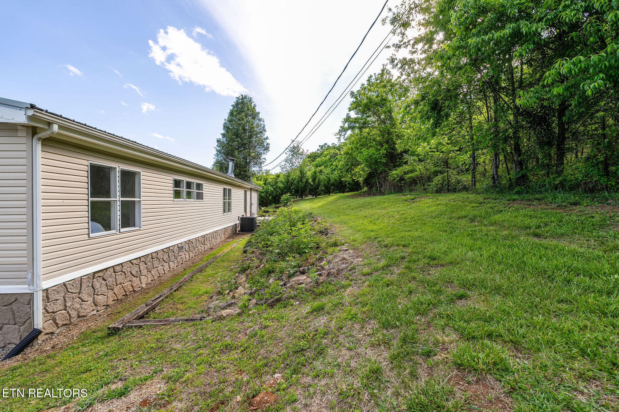 3315 Chuckey Highway Limestone, TN 37681 - Photo 36 of 40 a view of a house with a backyard